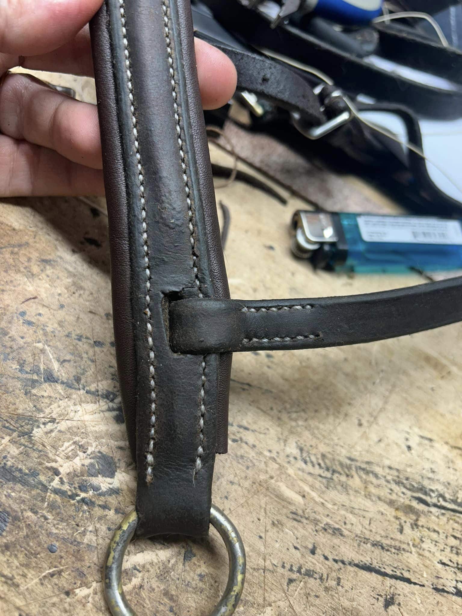 leather nose band for horse being repaired